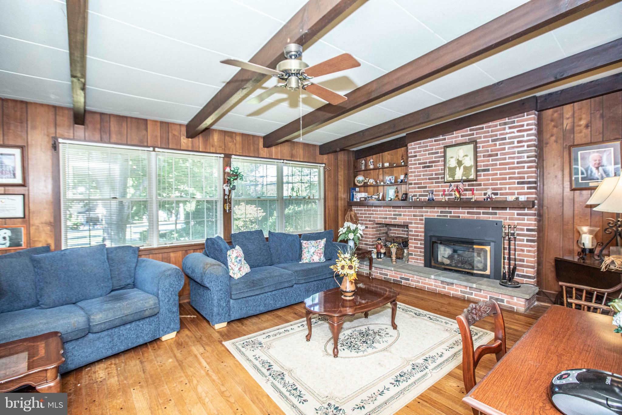 3328 Stoudts Ferry Bridge Road Reading, PA 19605 - Photo 16 of 29 a living room with furniture a fireplace and a large window