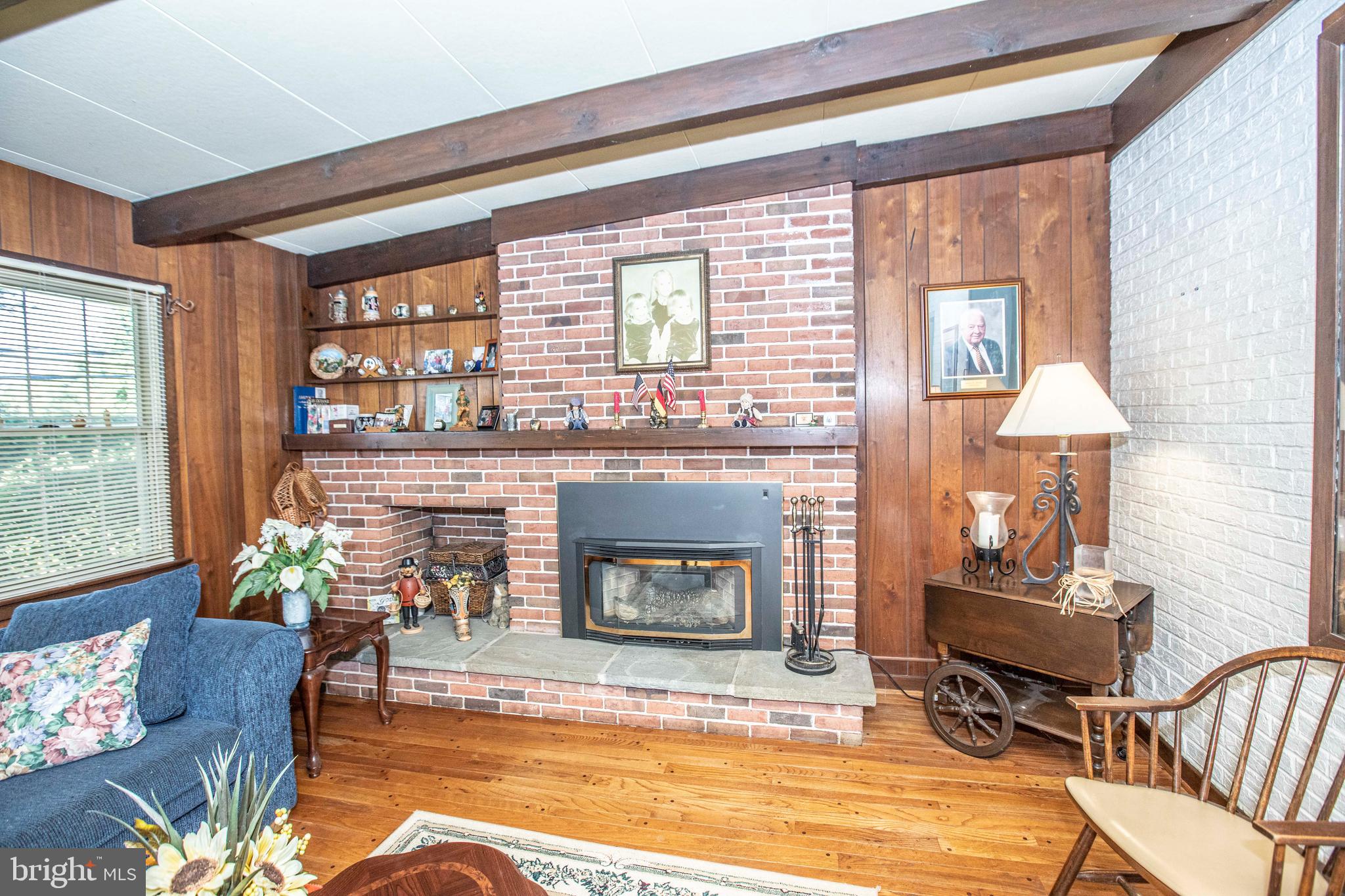 3328 Stoudts Ferry Bridge Road Reading, PA 19605 - Photo 18 of 29 a living room with furniture and a fireplace