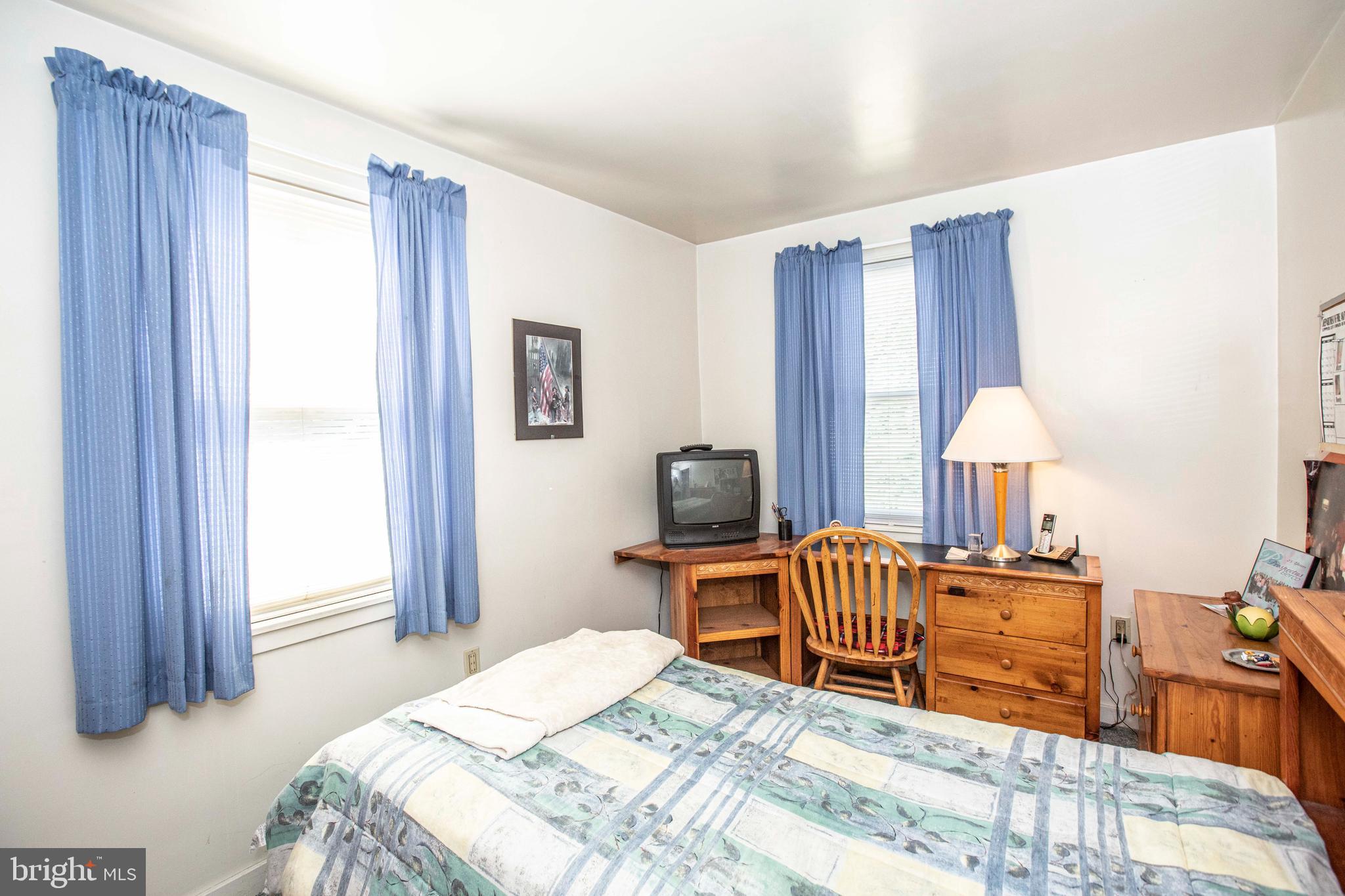 3328 Stoudts Ferry Bridge Road Reading, PA 19605 - Photo 9 of 29 a bedroom with a bed and a chandelier