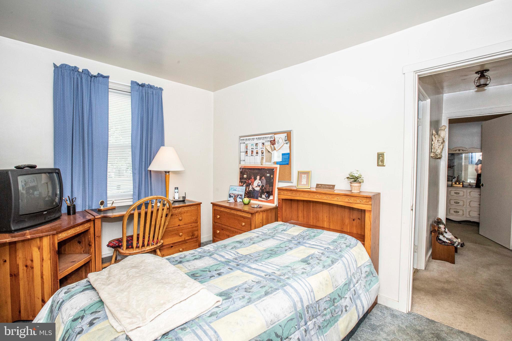 3328 Stoudts Ferry Bridge Road Reading, PA 19605 - Photo 10 of 29 a bedroom with furniture and a flat screen tv