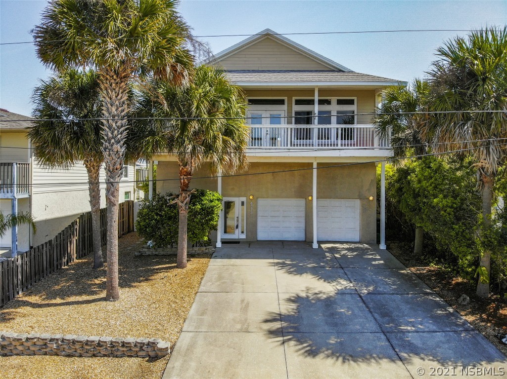 6273 Engram Road New Smyrna Beach, FL 32169 - Photo 1 of 34 a front view of a house with a yard and garage