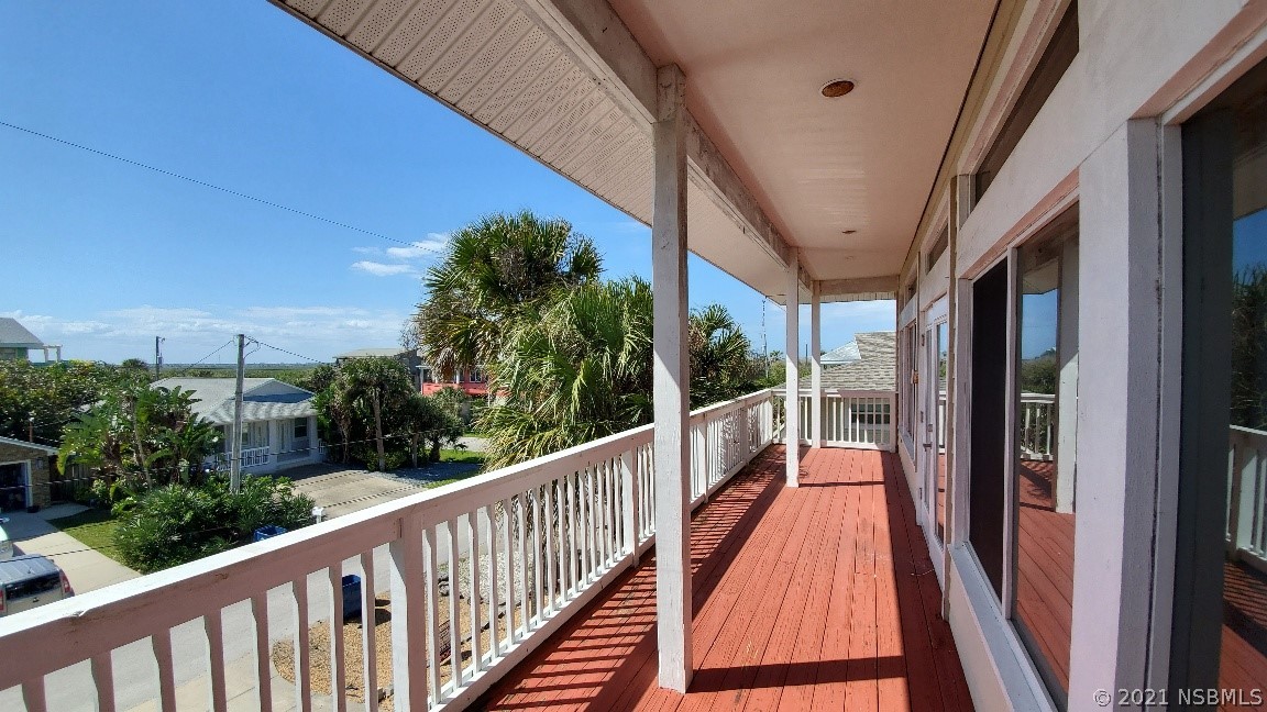 6273 Engram Road New Smyrna Beach, FL 32169 - Photo 18 of 34 a view of balcony with furniture