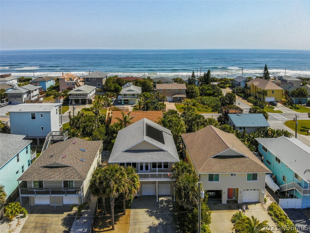 6273 Engram Road New Smyrna Beach, FL 32169 - Photo 2 of 34 an aerial view of multiple houses with a yard