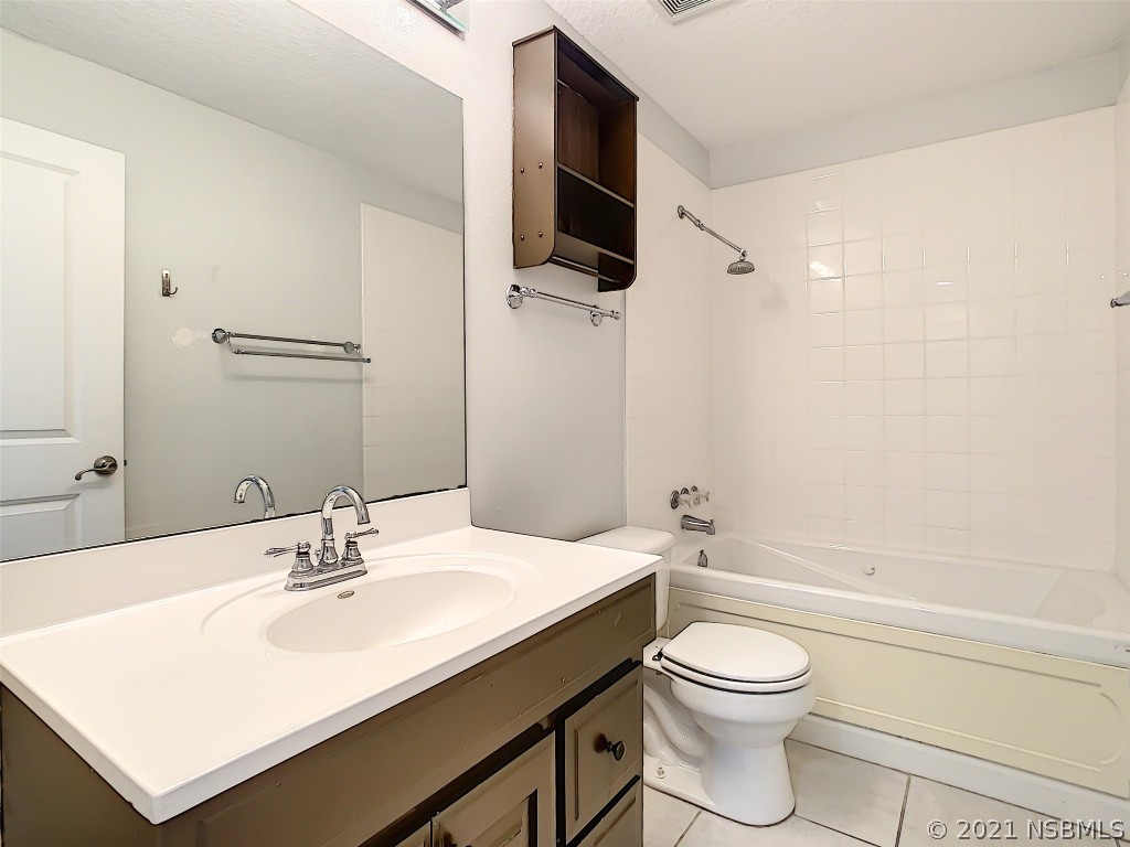 6273 Engram Road New Smyrna Beach, FL 32169 - Photo 28 of 34 a bathroom with a sink a toilet and shower