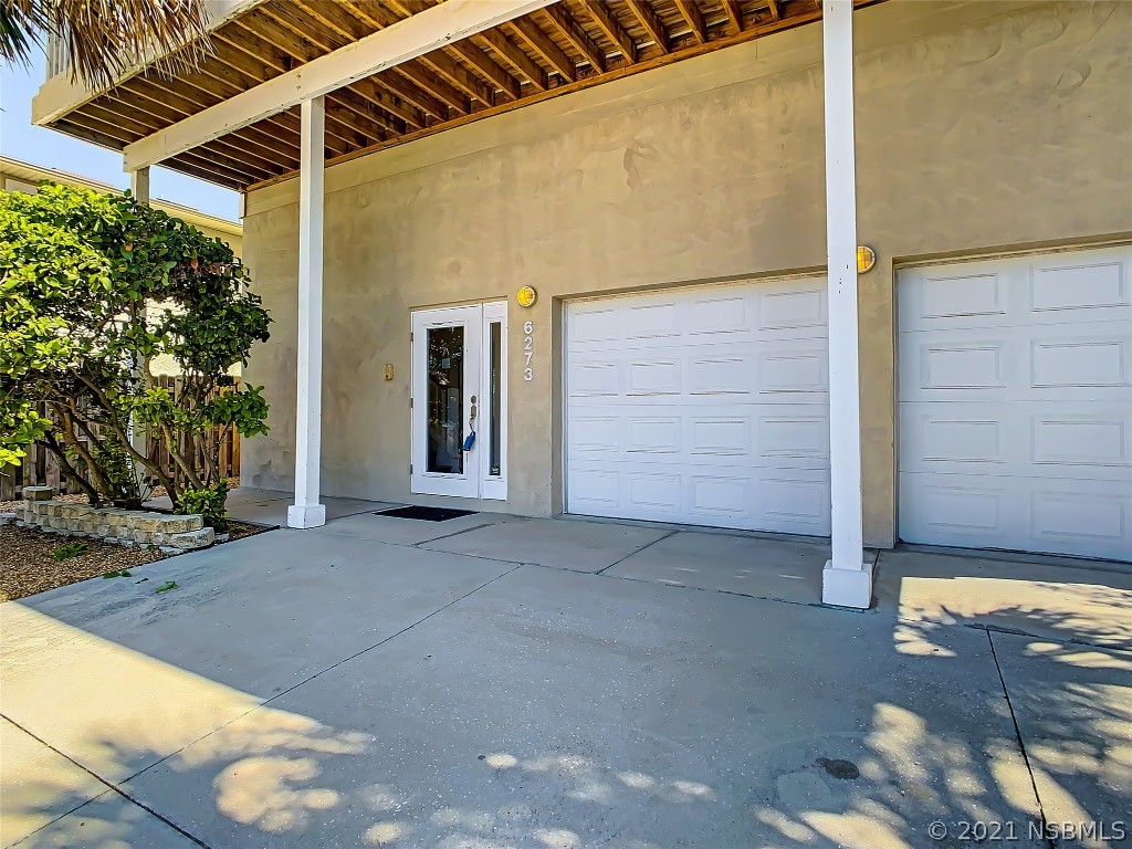 6273 Engram Road New Smyrna Beach, FL 32169 - Photo 3 of 34 a view of front door of house