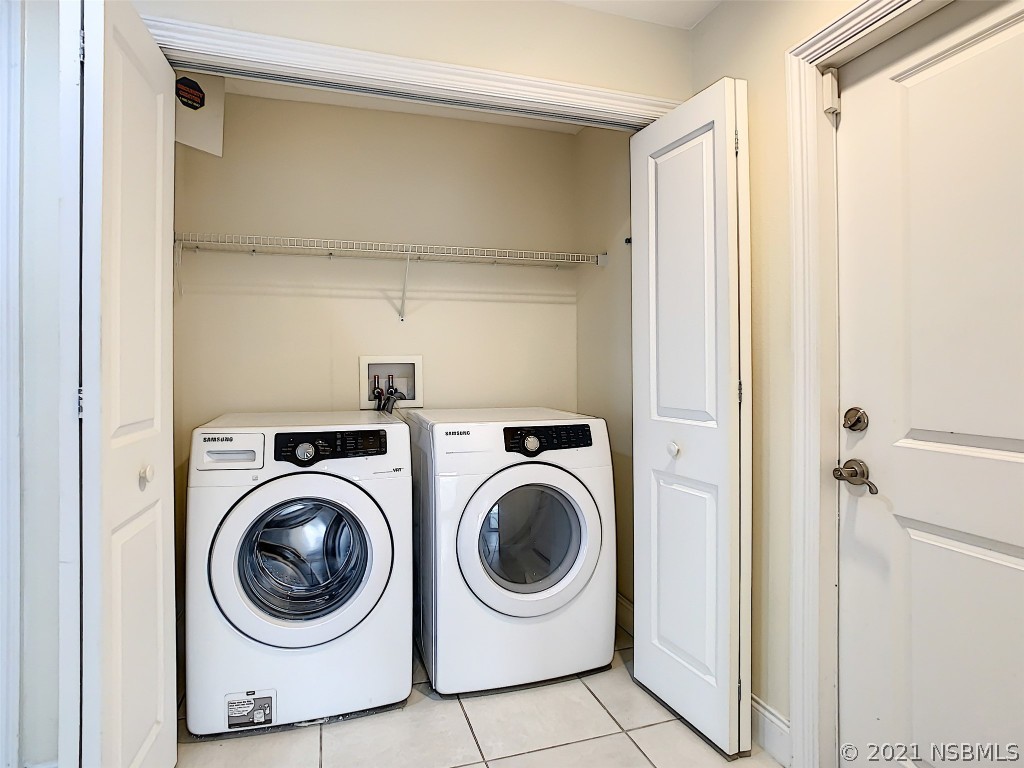 6273 Engram Road New Smyrna Beach, FL 32169 - Photo 31 of 34 a utility room with dryer and washer