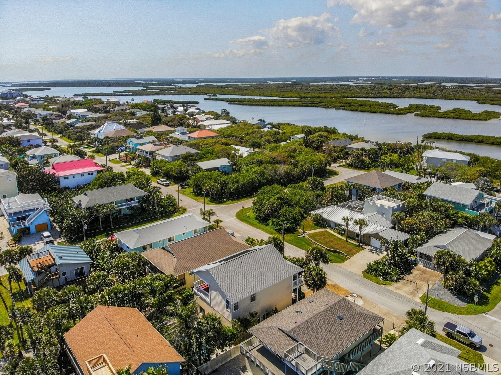 6273 Engram Road New Smyrna Beach, FL 32169 - Photo 34 of 34 an aerial view of a house with a lake view