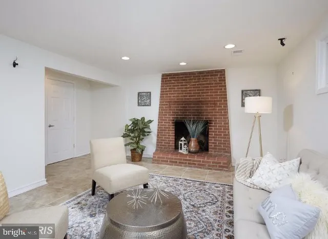 a living room with a couch and a fireplace