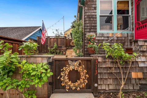 a view of a house with windows and plants