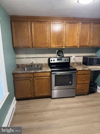 a kitchen with a stove and a sink