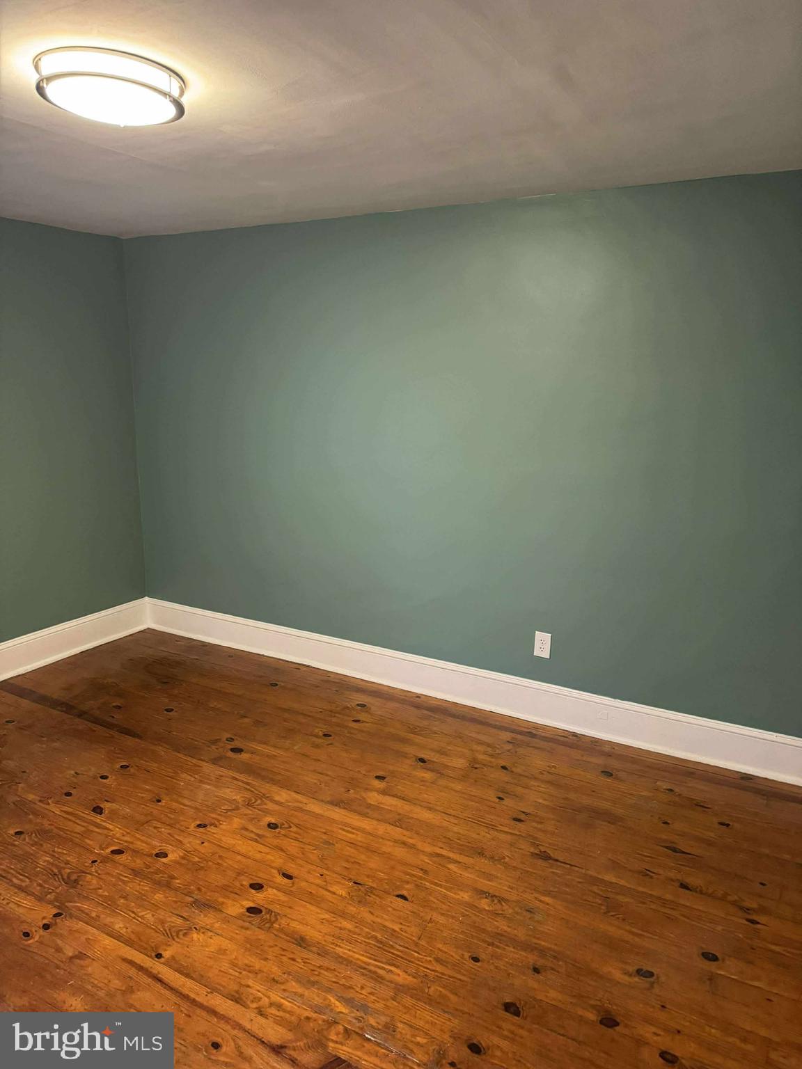 1931 Valley Road, Unit 2 Parkesburg, PA 19365 - Photo 3 of 10 en empty room with wooden floor and windows