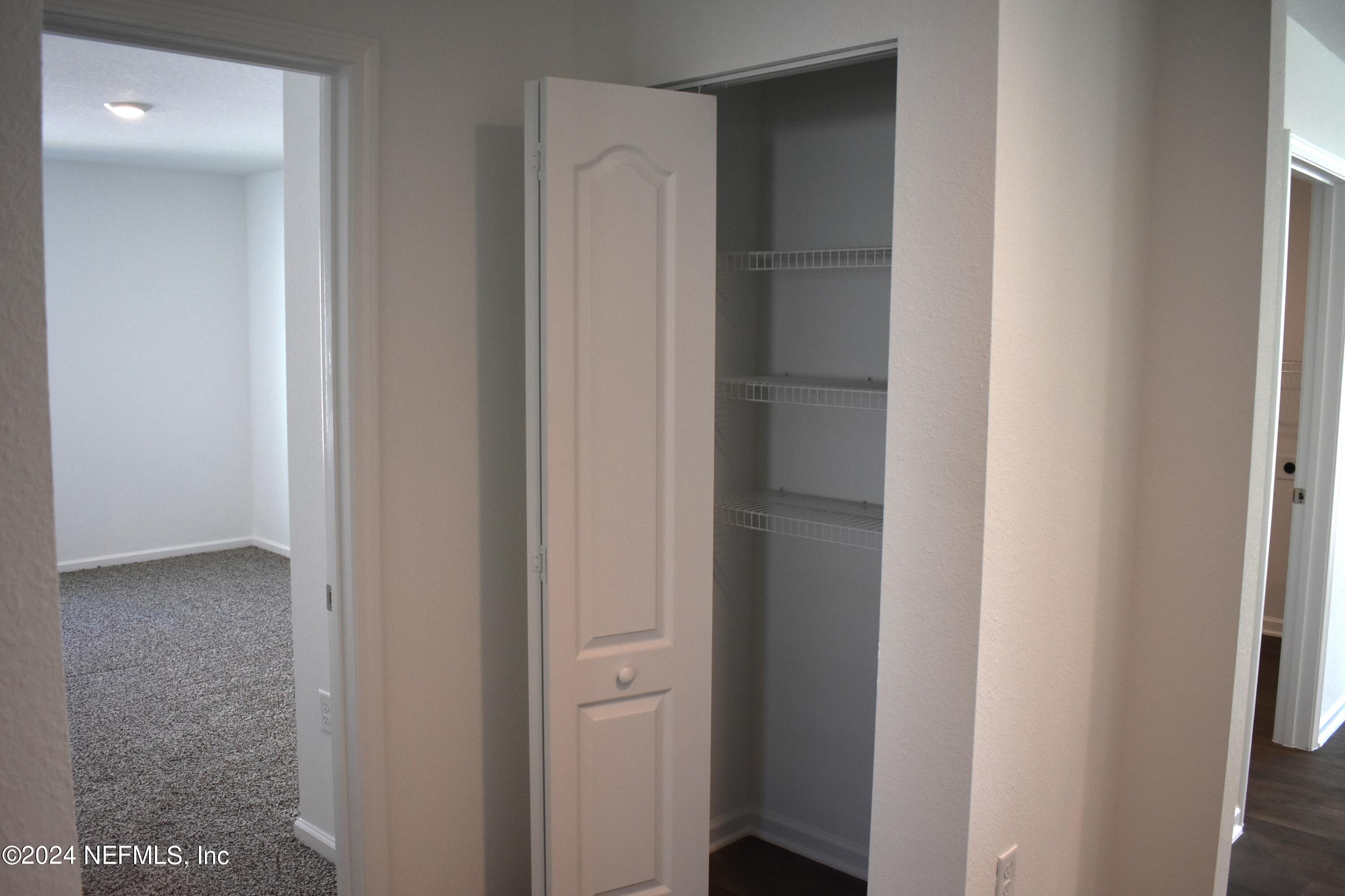12725 European Beech Road Jacksonville, FL 32218 - Photo 9 of 36 a view of a hallway