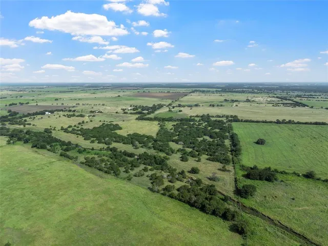 a view of a lake with a yard