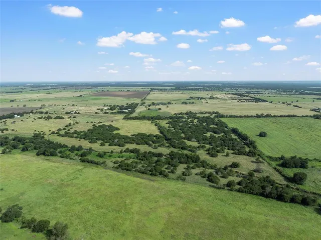a view of an ocean and a yard