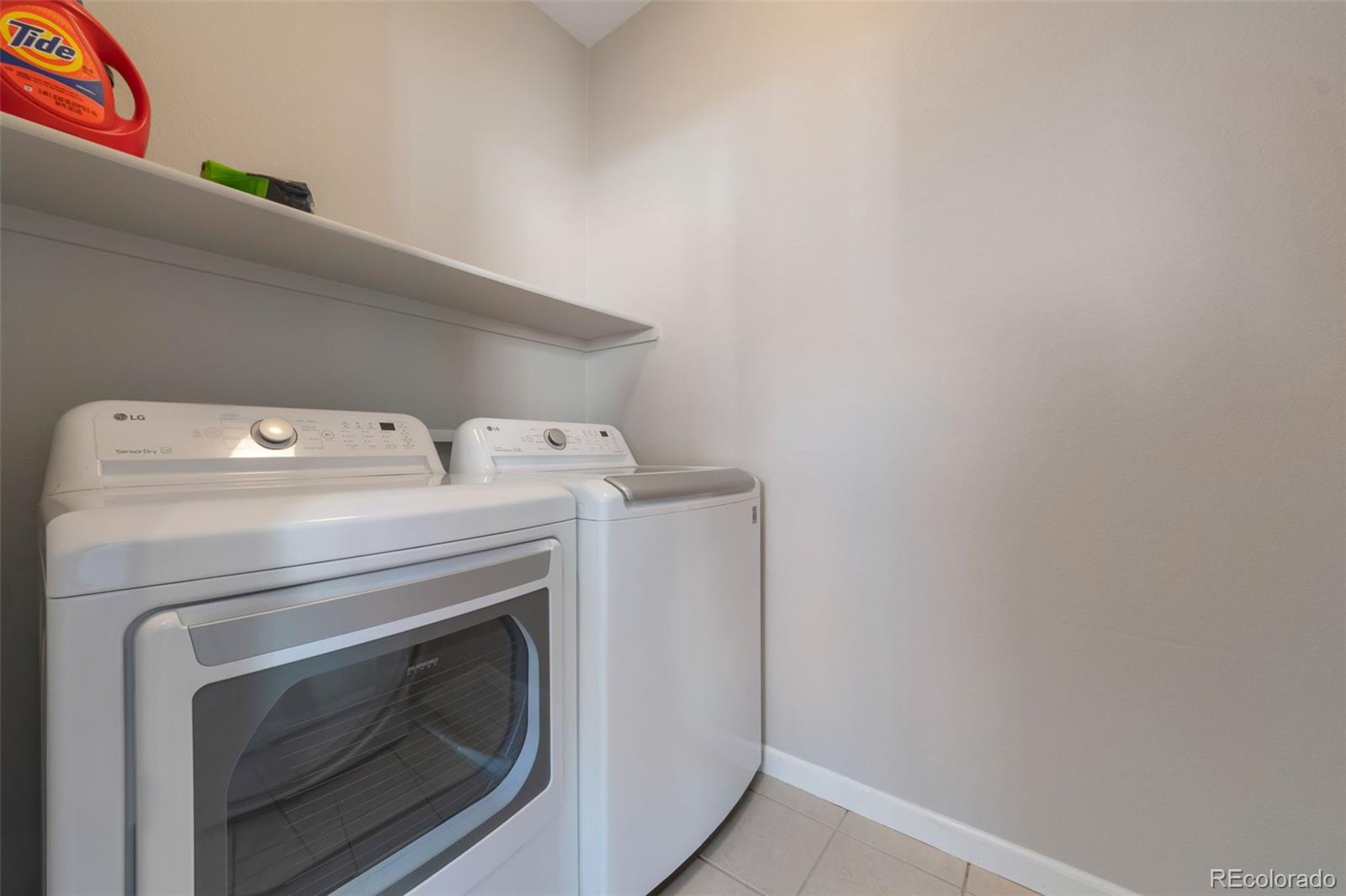 85 Uinta Way, Unit 603 Denver, CO 80230 - Photo 11 of 25 a utility room with dryer and washer