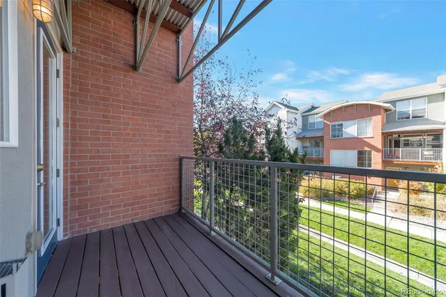 a view of a balcony with wooden floor