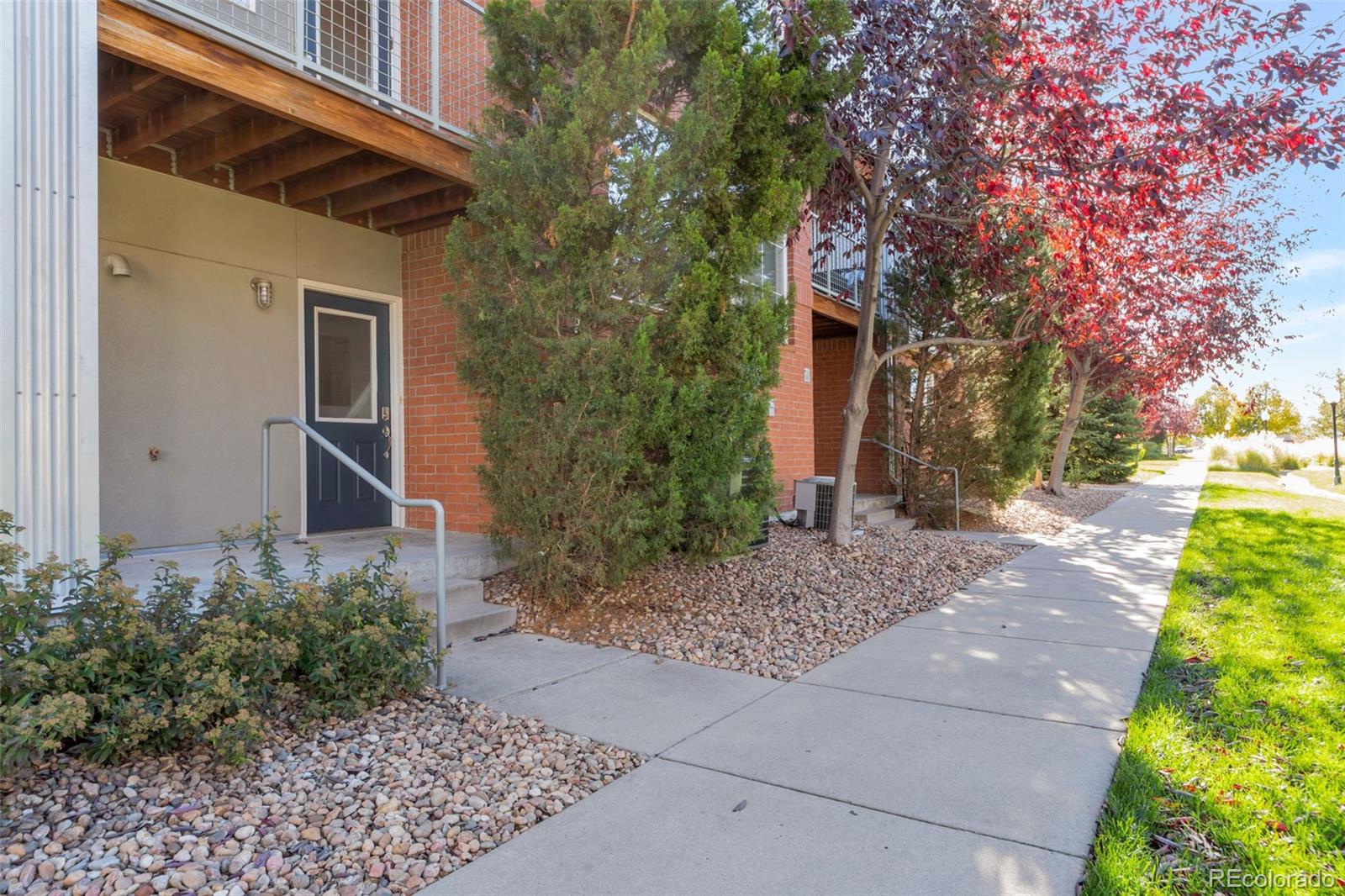 85 Uinta Way, Unit 603 Denver, CO 80230 - Photo 2 of 25 a backyard of a house with lots of green space