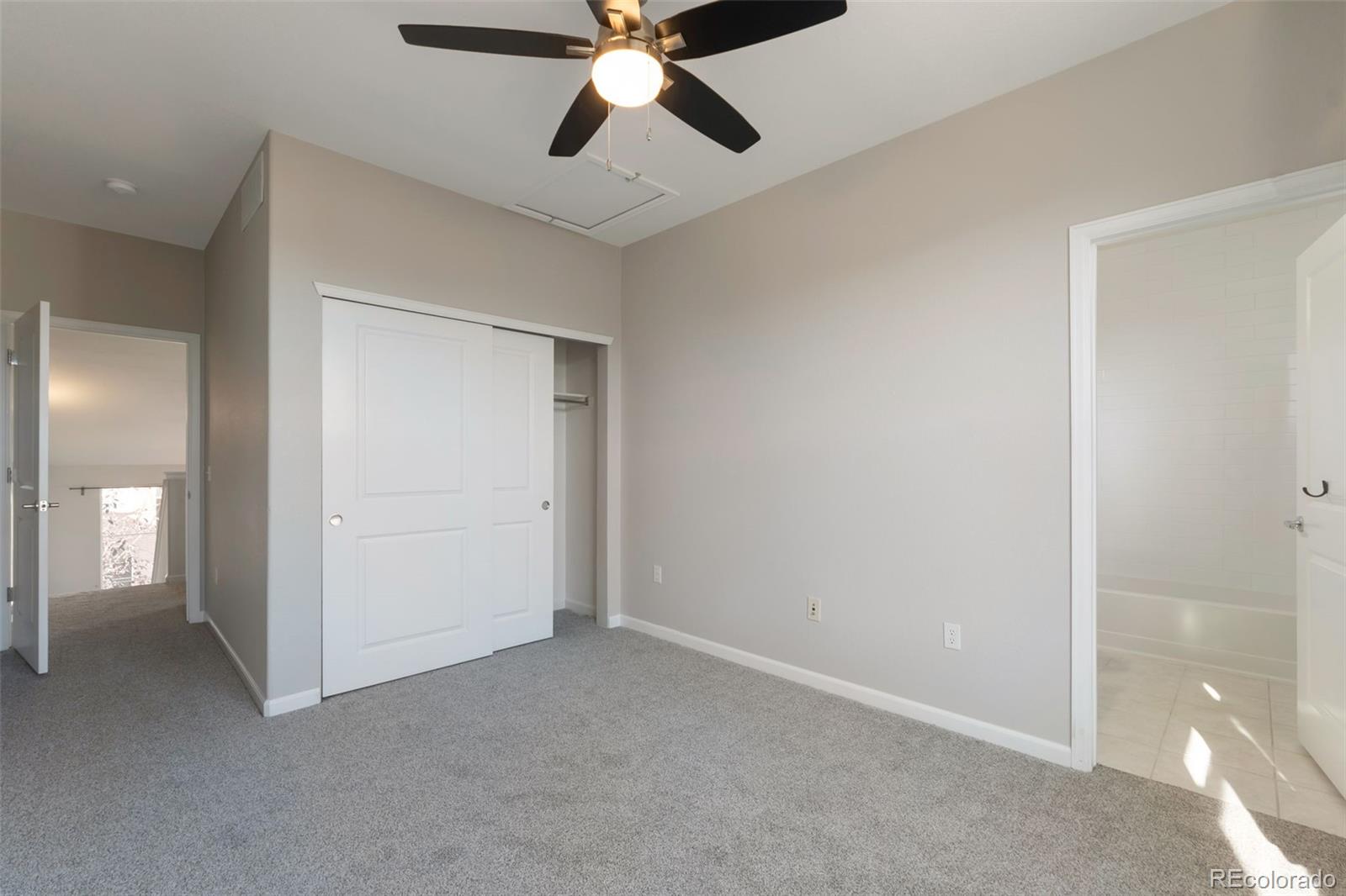85 Uinta Way, Unit 603 Denver, CO 80230 - Photo 21 of 25 an empty room with closet and a chandelier fan