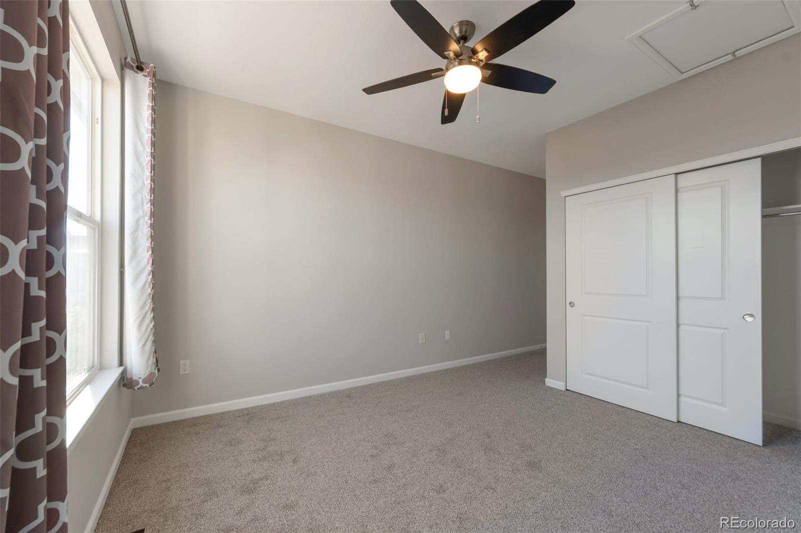 85 Uinta Way, Unit 603 Denver, CO 80230 - Photo 22 of 25 an empty room with windows and fan