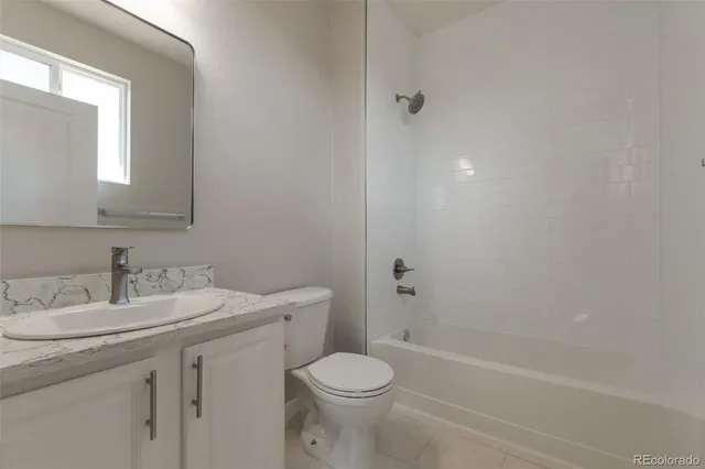 a bathroom with a sink toilet and vanity