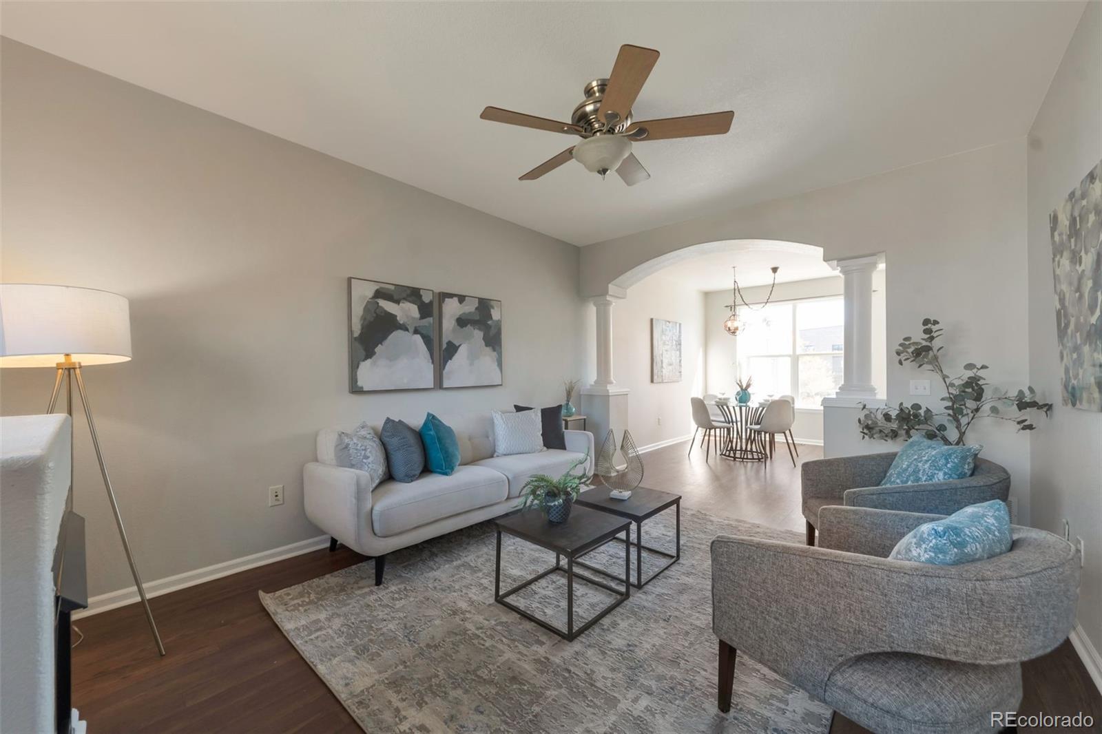 85 Uinta Way, Unit 603 Denver, CO 80230 - Photo 4 of 25 a living room with furniture and a ceiling fan