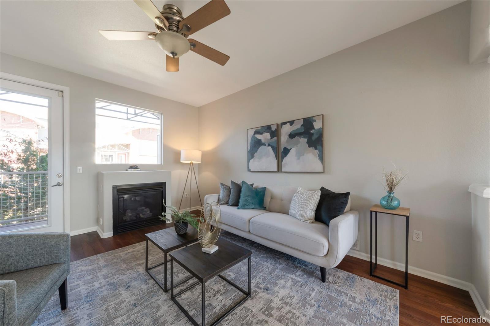 85 Uinta Way, Unit 603 Denver, CO 80230 - Photo 6 of 25 a living room with furniture and a fireplace