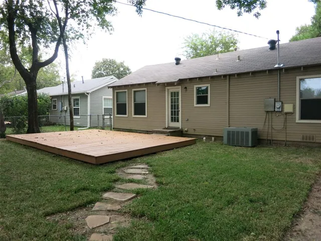 a view of a backyard with a garden and plants