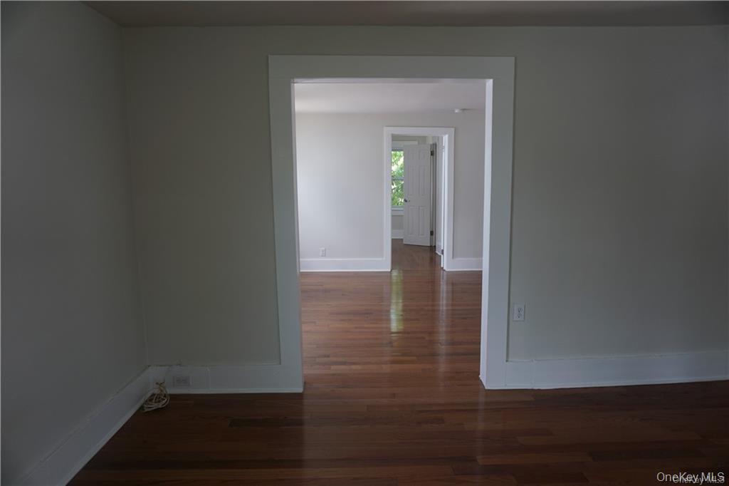 63 Spring Street Mount Kisco, NY 10549 - Photo 5 of 11 a view of a hallway with wooden floor