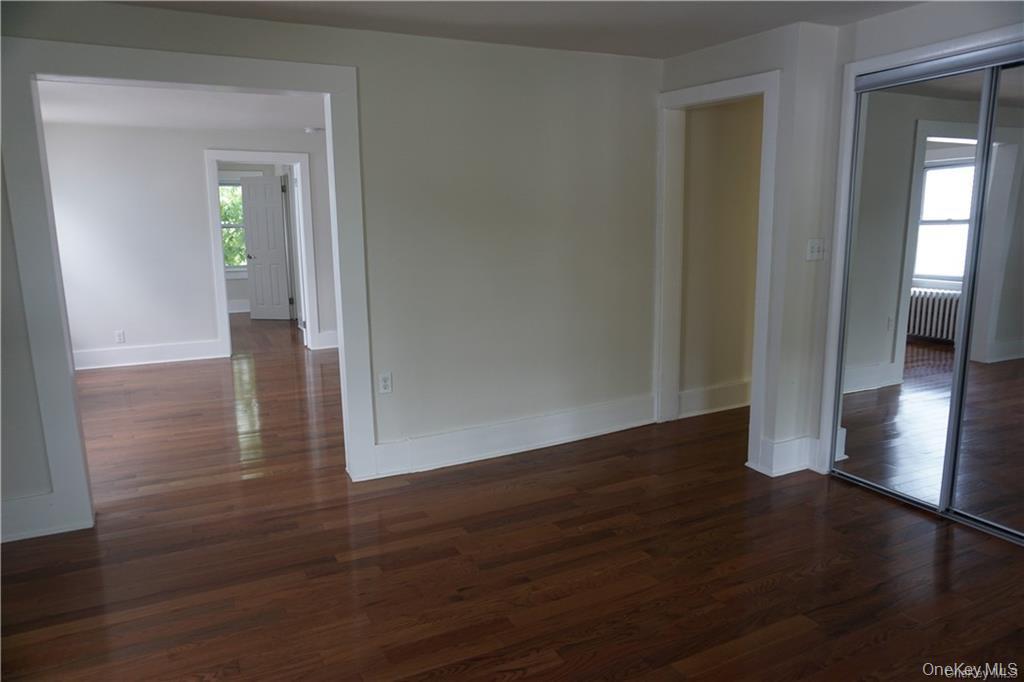 63 Spring Street Mount Kisco, NY 10549 - Photo 6 of 11 a view of a hallway with wooden floor