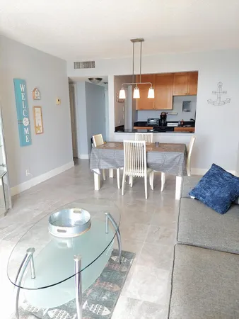 a kitchen with a table and chairs