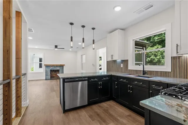 a kitchen with a sink and cabinets