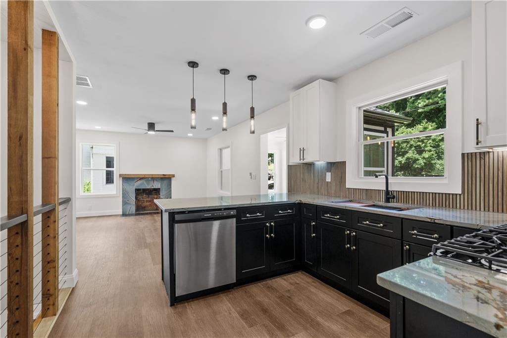 1658 Altadena Place Southwest Atlanta, GA 30311 - Photo 12 of 47 a kitchen with a sink and cabinets