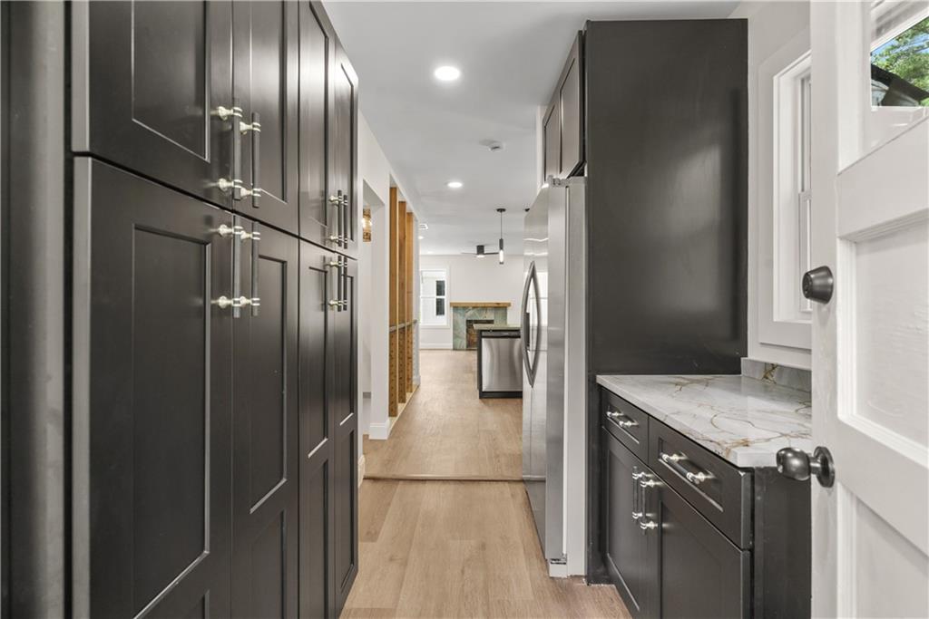1658 Altadena Place Southwest Atlanta, GA 30311 - Photo 14 of 47 a kitchen with stainless steel appliances granite countertop a refrigerator and a sink