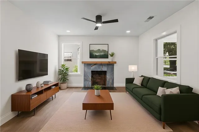 a living room with furniture and a fireplace