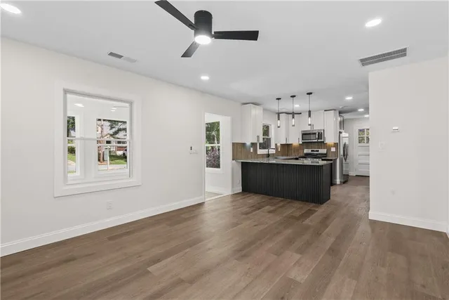 a view of kitchen with wooden floor