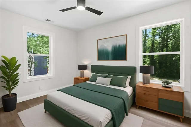 a bedroom with a large bed and a window