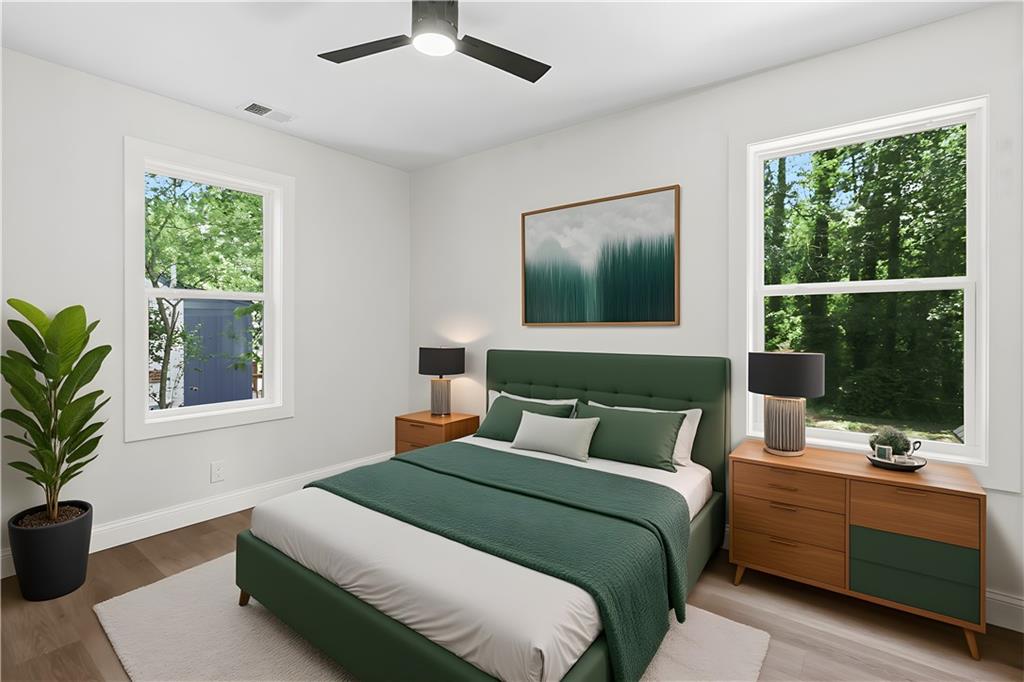 1658 Altadena Place Southwest Atlanta, GA 30311 - Photo 21 of 47 a bedroom with a large bed and a window