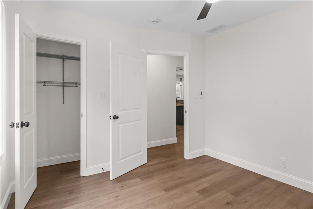 1658 Altadena Place Southwest Atlanta, GA 30311 - Photo 26 of 47 an empty room with wooden floor & closet area