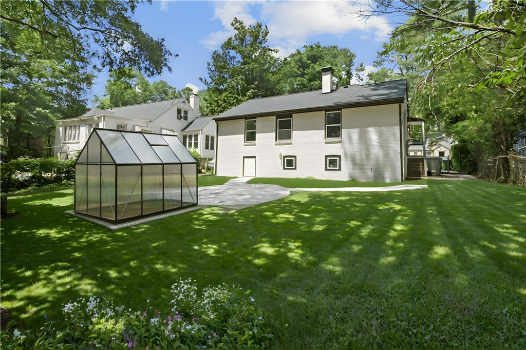1658 Altadena Place Southwest Atlanta, GA 30311 - Photo 34 of 47 a view of a house with a yard