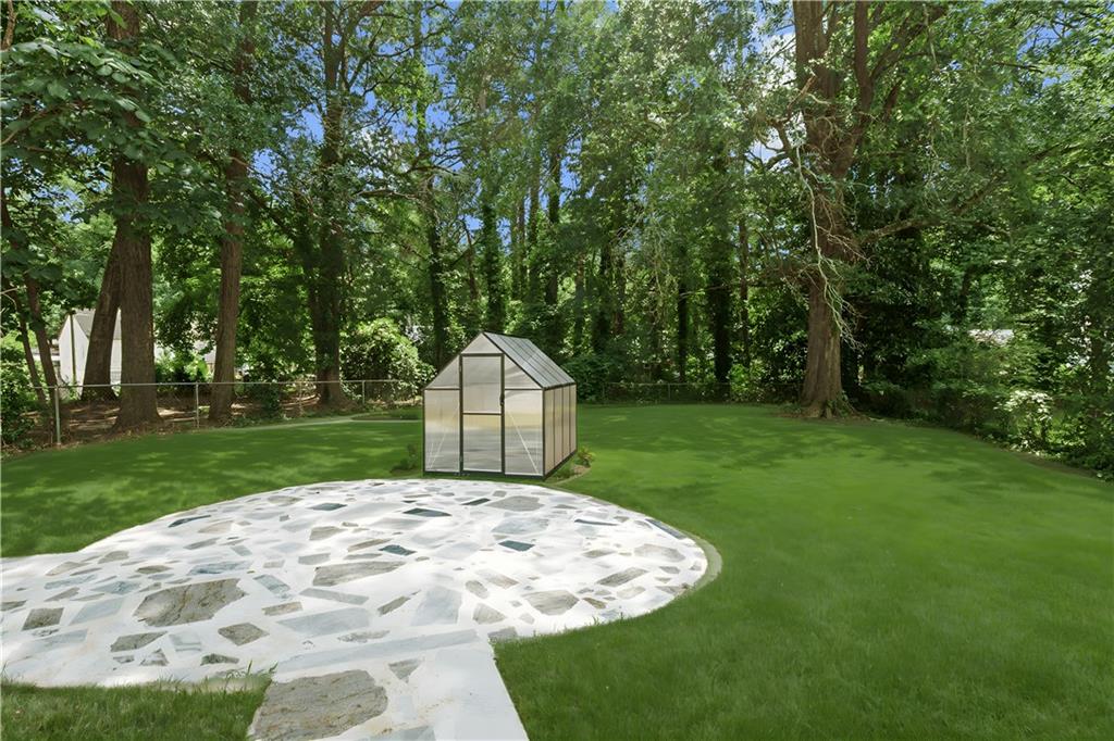 1658 Altadena Place Southwest Atlanta, GA 30311 - Photo 36 of 47 a view of a backyard with a garden and entertaining space