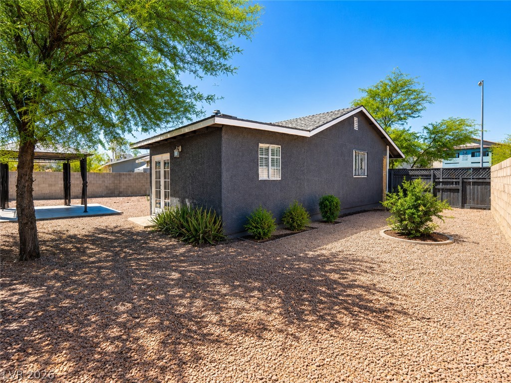 2870 South Sandhill Road Las Vegas, NV 89121 - Photo 19 of 64 An inviting backyard oasis offers a shaded patio with a gazebo, perfect for relaxation.