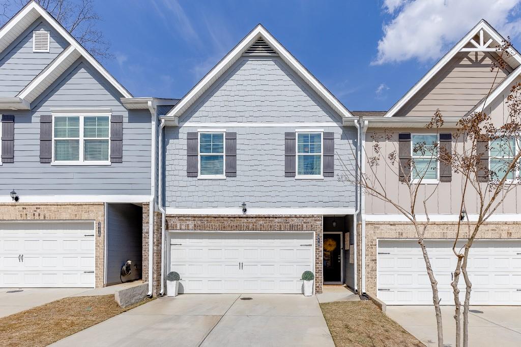 a view of a house with a door and wooden walls