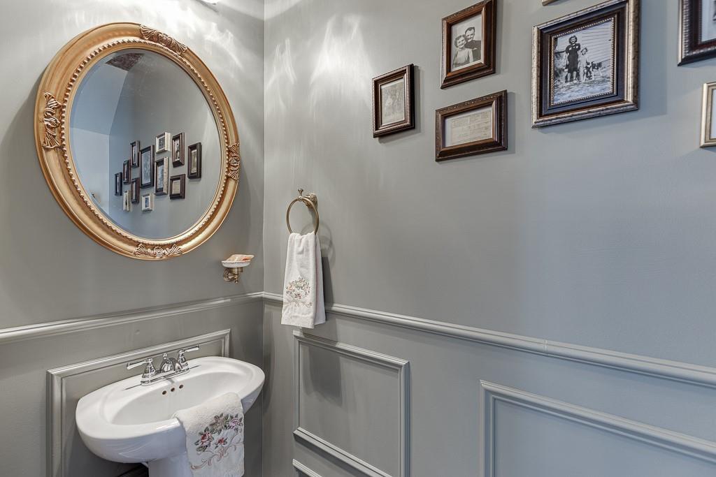 3712 Abbey Way Gainesville, GA 30507 - Photo 15 of 44 a bathroom with a sink and a mirror