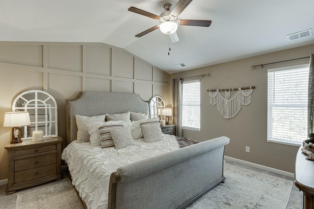 3712 Abbey Way Gainesville, GA 30507 - Photo 16 of 44 a bedroom with a bed and a chandelier