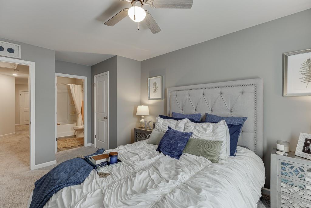 3712 Abbey Way Gainesville, GA 30507 - Photo 22 of 44 a bedroom with a bed and a chandelier