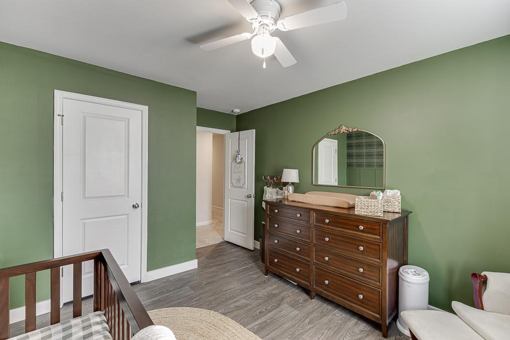 3712 Abbey Way Gainesville, GA 30507 - Photo 29 of 44 a room with a dresser and a mirror