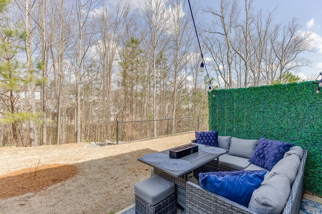 3712 Abbey Way Gainesville, GA 30507 - Photo 34 of 44 a view of a backyard with a table and chairs