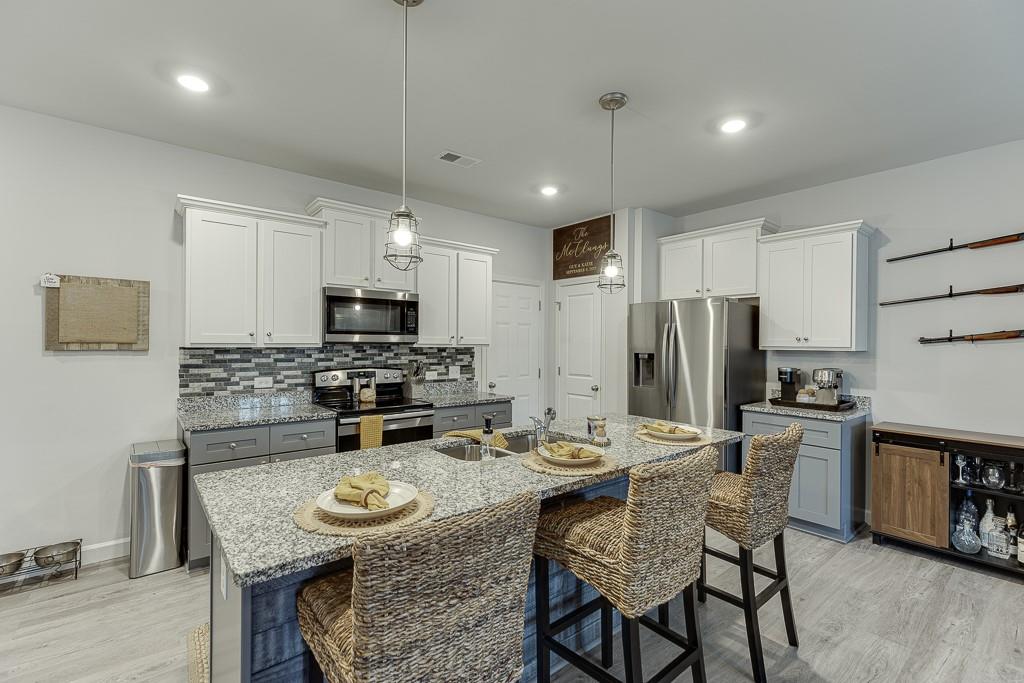 3712 Abbey Way Gainesville, GA 30507 - Photo 8 of 44 a view of a dining room with furniture