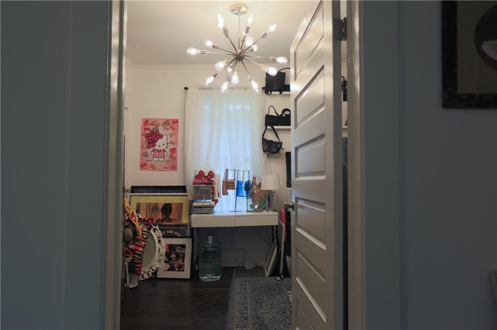 938 Ormewood Avenue Southeast Atlanta, GA 30316 - Photo 11 of 21 a view of a dining room with furniture and a chandelier fan