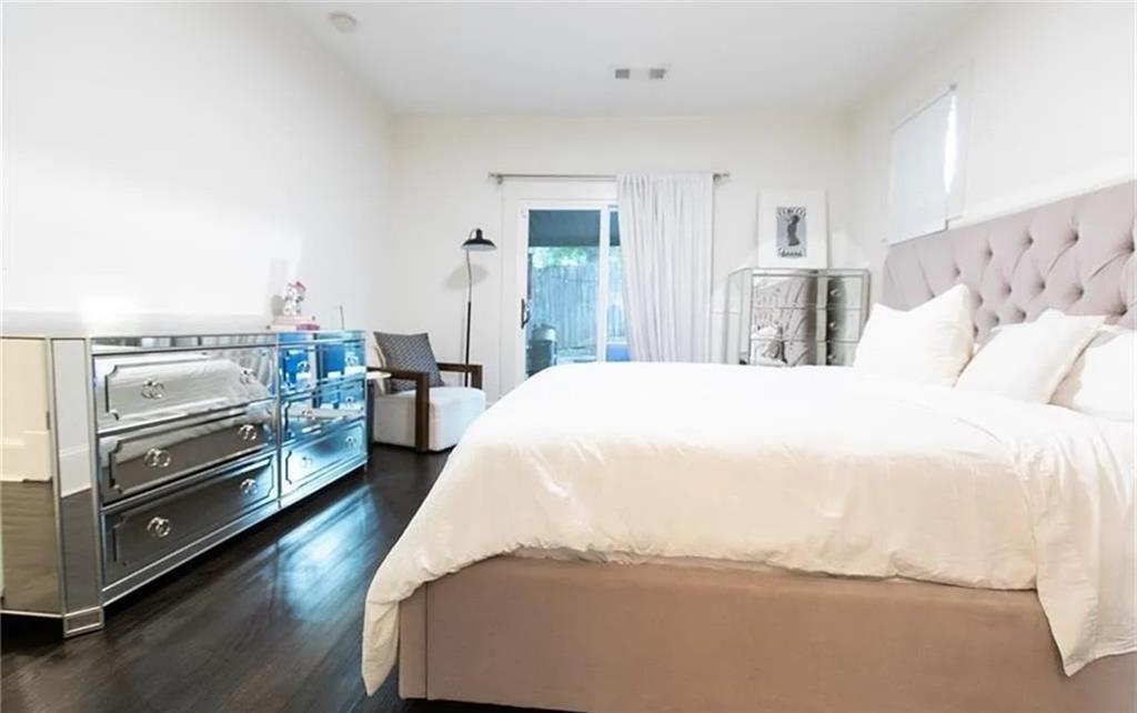 938 Ormewood Avenue Southeast Atlanta, GA 30316 - Photo 13 of 21 a spacious bedroom with a bed and a view of kitchen